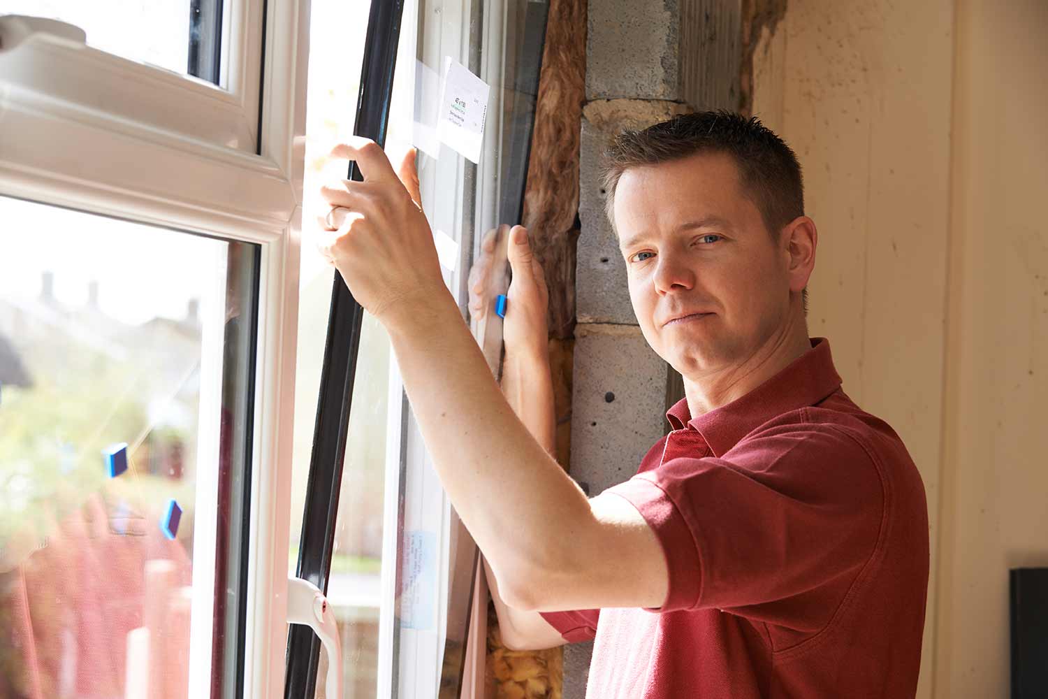 Man replacing a window professionally in Calgary